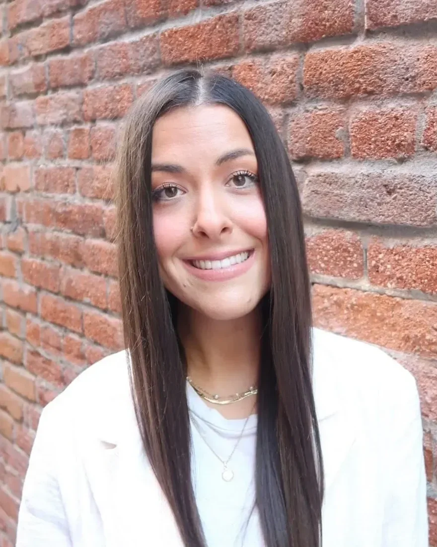 Sage McEntee, marriage and family therapist, smiling outdoors